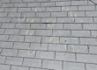 Shingled roof with chalk markings.